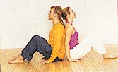 Sit back-to-back, knees bent, hands on floor. For two minutes, focus on breathing and feeling your partner's back.